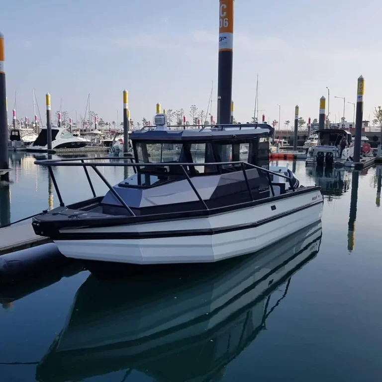 Plate aluminium cabin boats berthed in a city marina