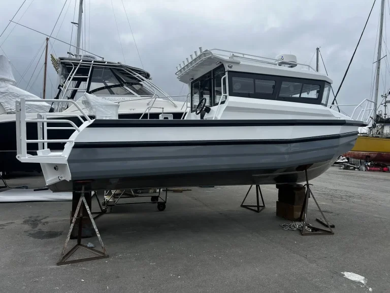 Plate aluminium cabin boats on stands outside the factory