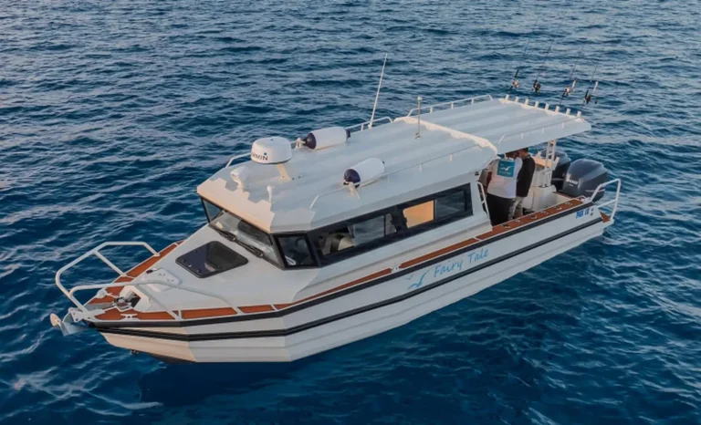 Plate aluminium cabin cruiser under way offshore