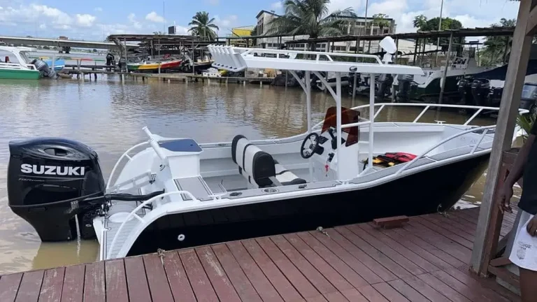 Plate aluminium centre console with Suzuki outboard at a wharf