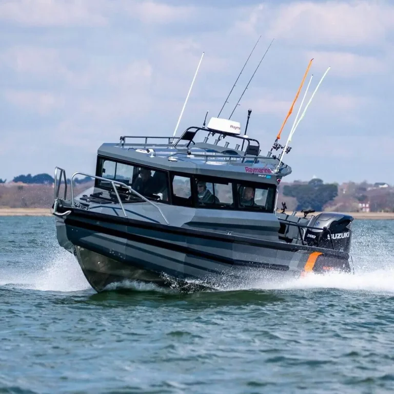 Plate aluminium hardtop boat at speed with a Suzuki outboard