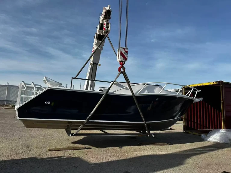 Plate aluminium hull lifted by crane at the yard