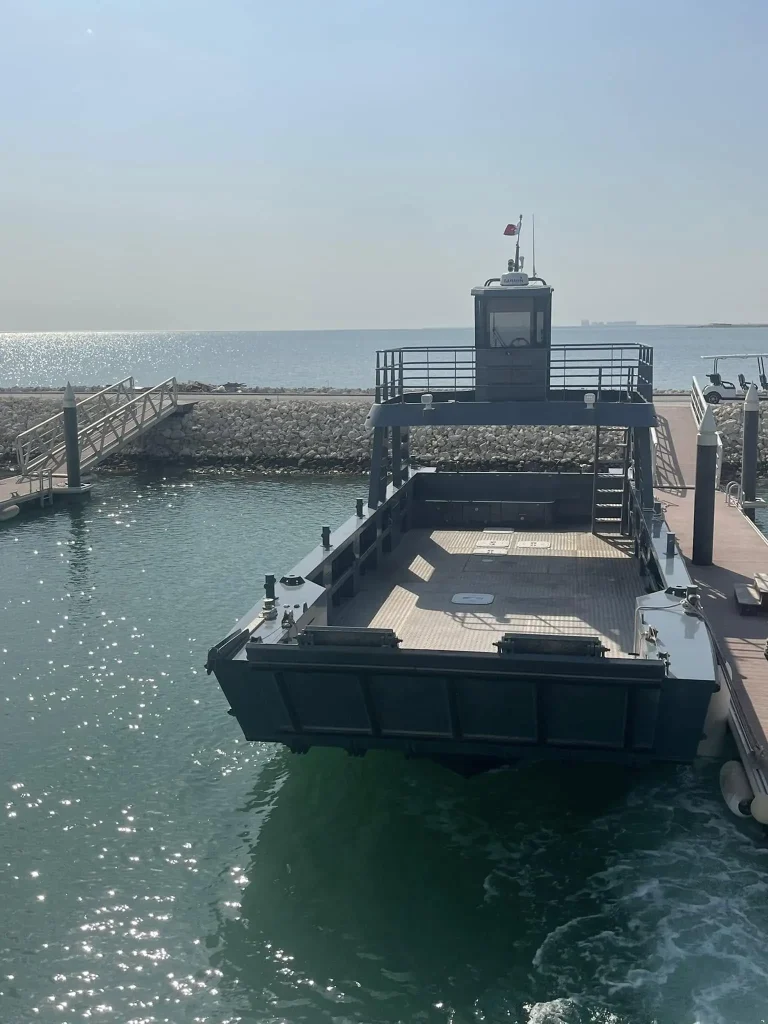 Plate aluminium landing craft entering a harbour