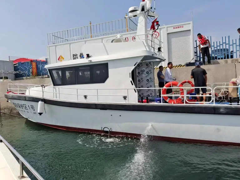 Plate aluminium patrol boat alongside a wharf