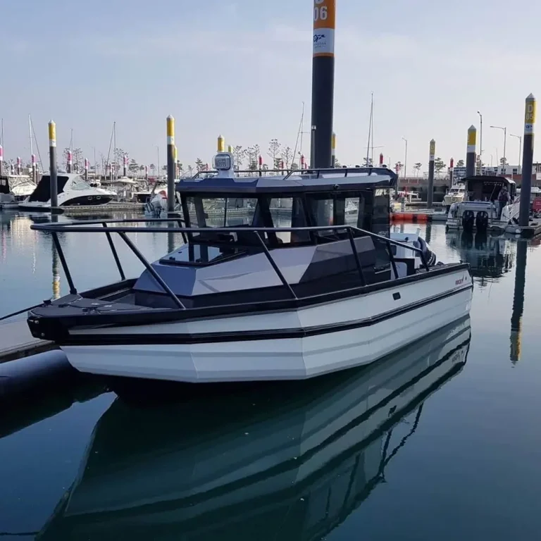 Plate aluminium sports cruiser berthed in a marina
