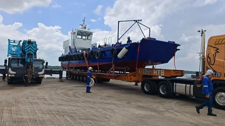 Plate aluminium work boat loaded on a truck