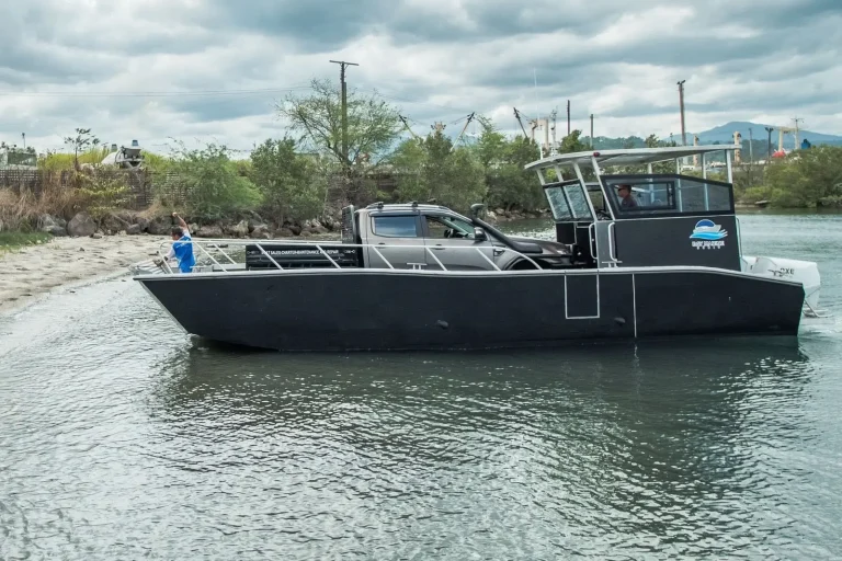 Plate aluminium work boat moored off the beach
