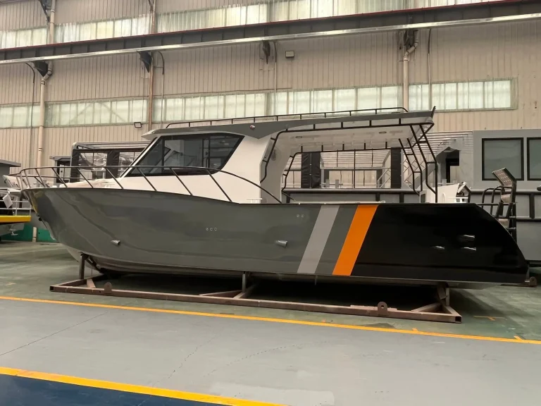 Plate aluminium work boat with orange stripe in build