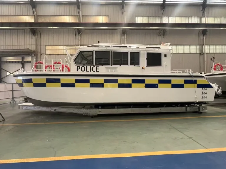 Police boat with checkered livery in the factory