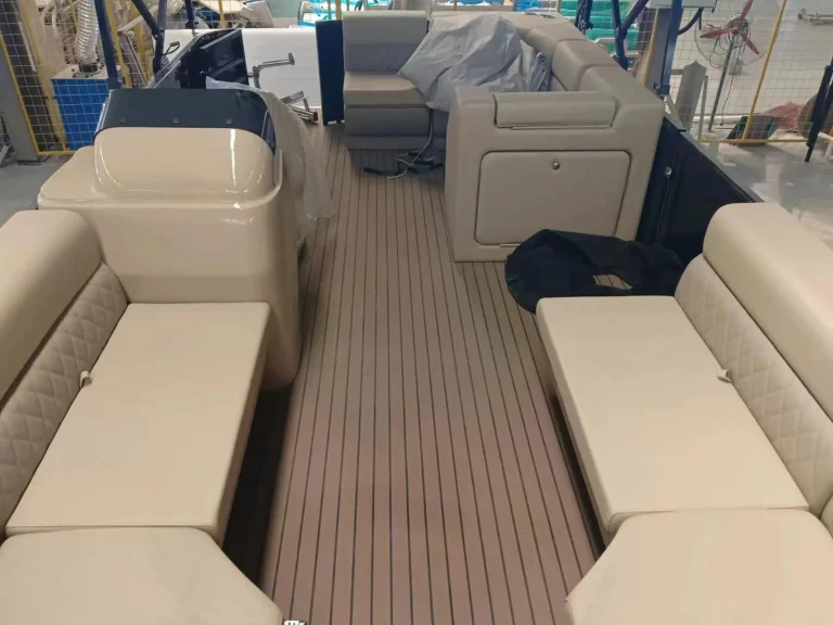 Pontoon boat interior with wraparound lounge seating