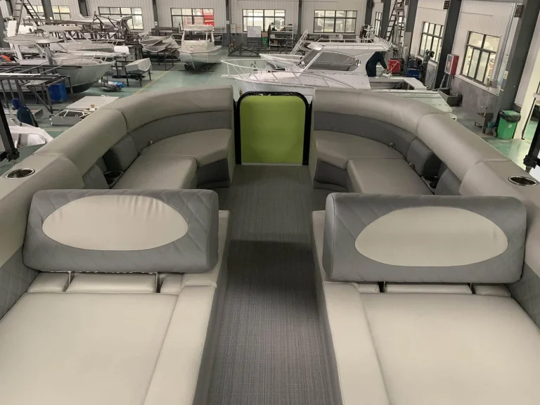 Pontoon boat rear lounge with green trim