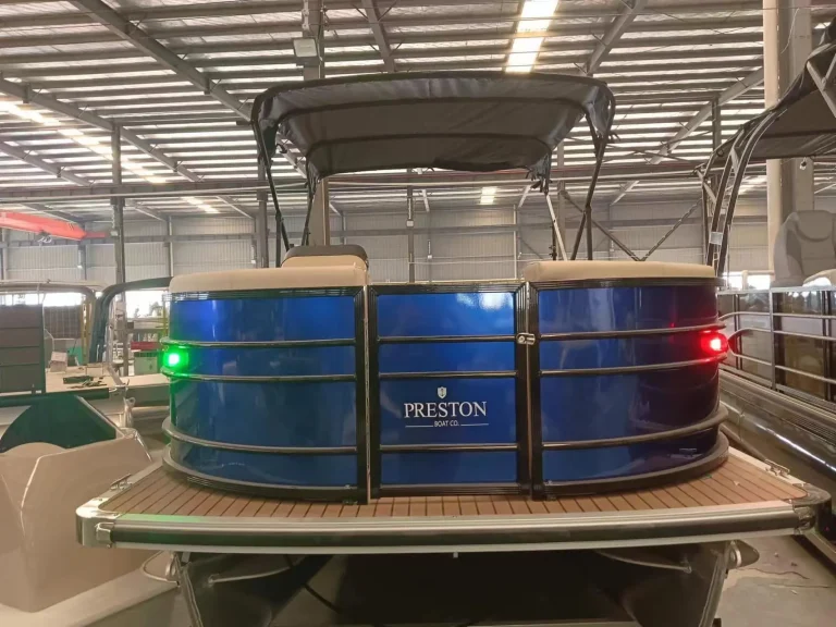 Pontoon boat with blue LED lighting in the factory