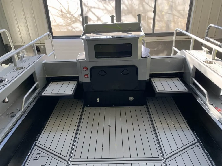 Rear deck with grey teak look flooring and side rails