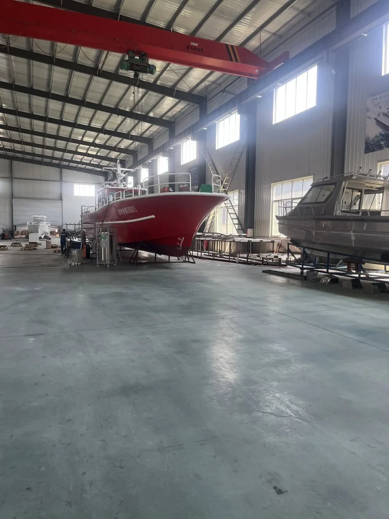 Red work boat on stands in the factory