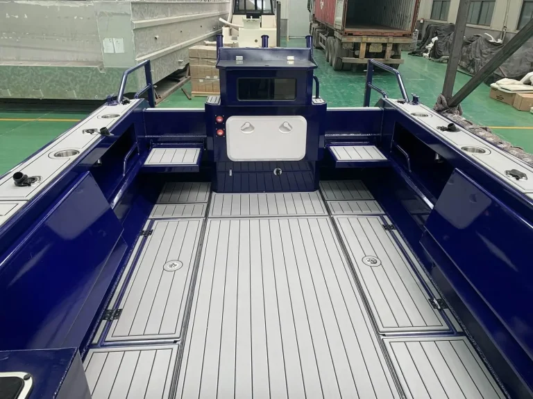 Self draining deck with teak look flooring and storage hatches