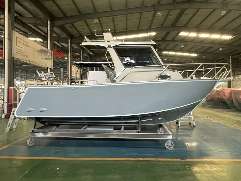 Side view of a bare aluminium centre console hull