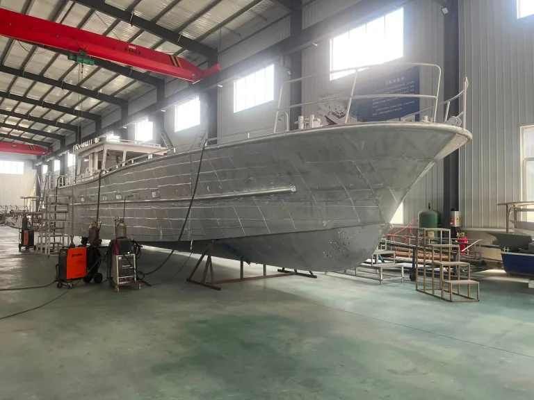 Side view of a bare aluminium hull in the factory