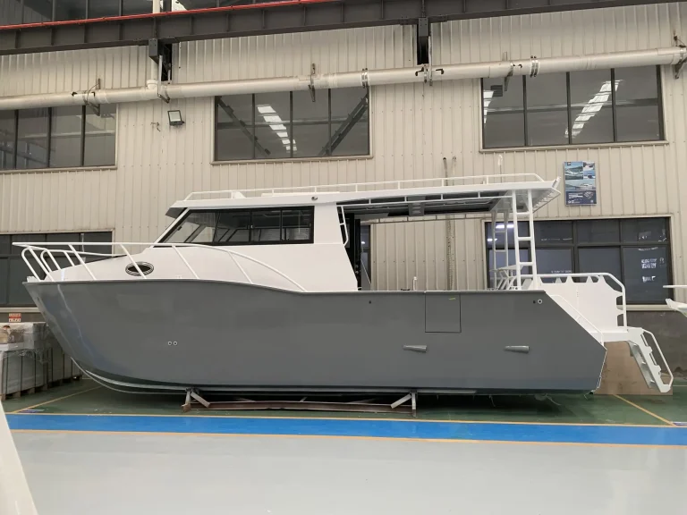 Side view of a grey plate aluminium cruiser in build