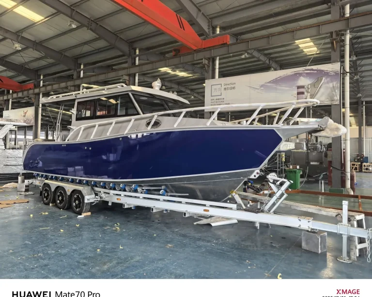 Side view of a navy plate aluminium hull on a trailer