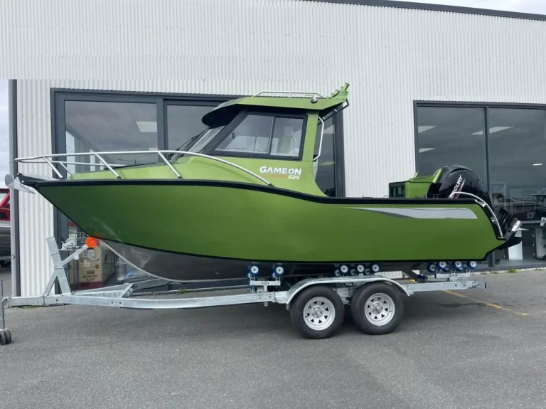 Side view of an olive green hardtop plate aluminium boat