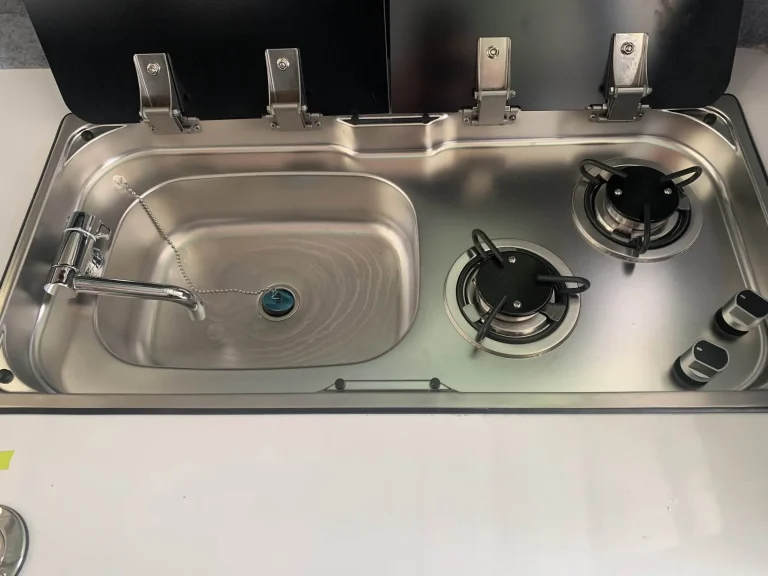 Stainless sink and gas cooktop in a boat galley