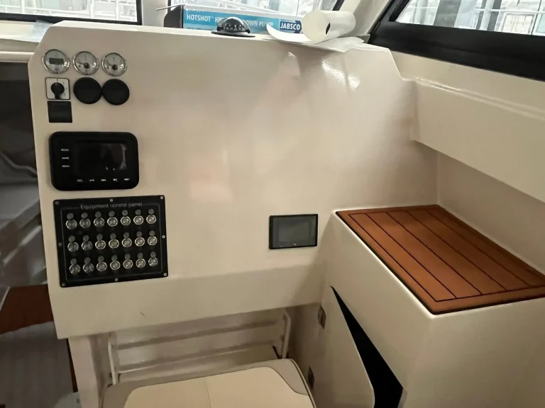 Switch panel and helm dash with timber trim