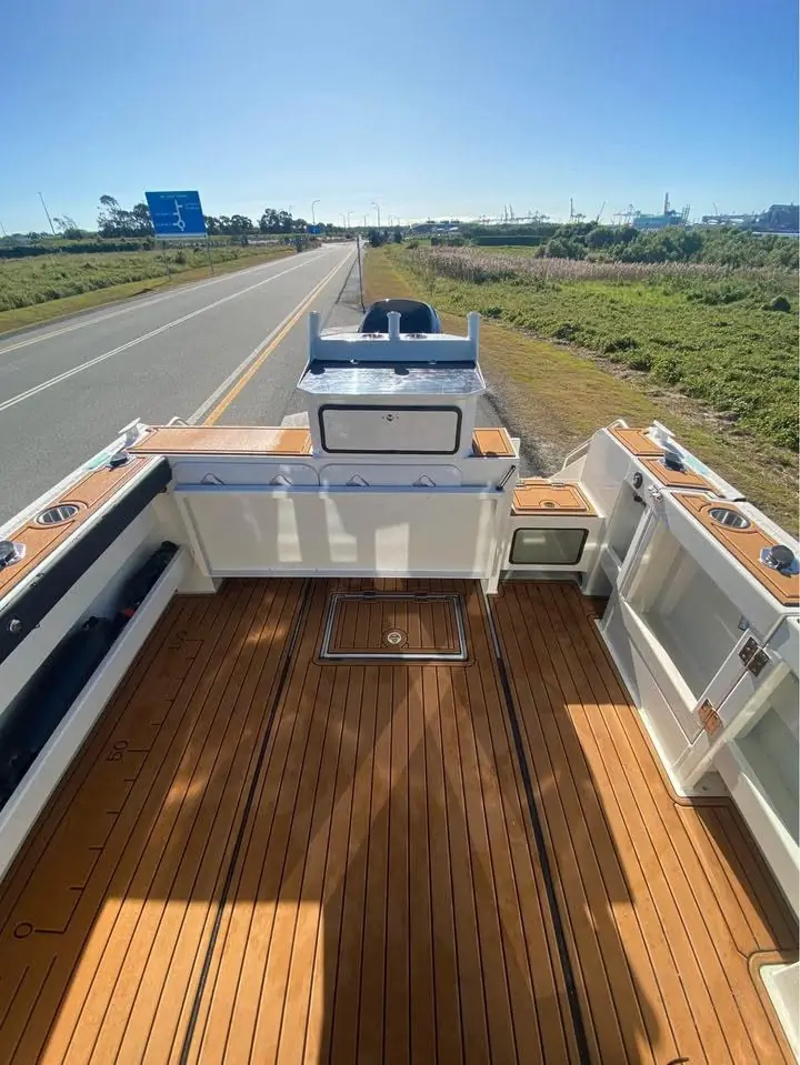 Teak look rear deck of a boat under tow