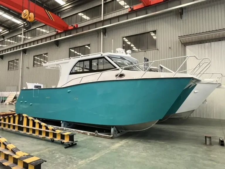 Teal and white plate aluminium boat in the factory