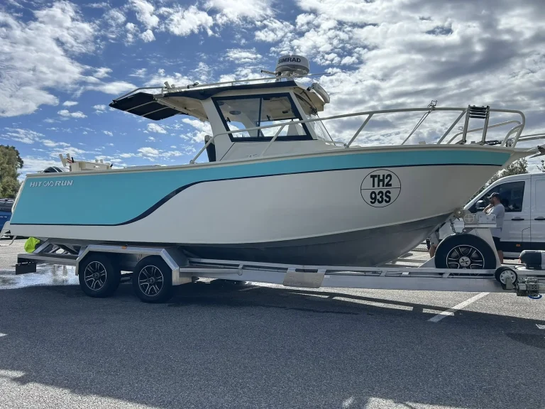 Teal and white plate aluminium centre console on a trailer