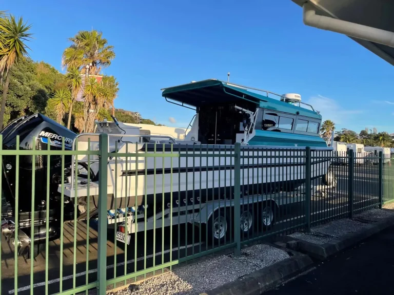 Teal plate aluminium charter boat on a trailer