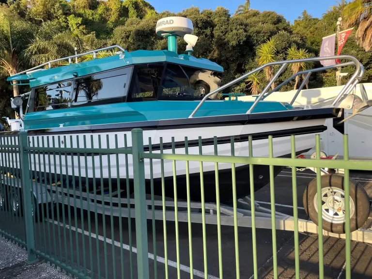 Teal roofed plate aluminium charter boat with radar