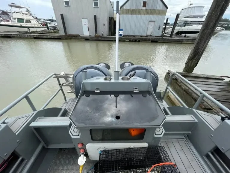 Transom bait station and outboard rigging