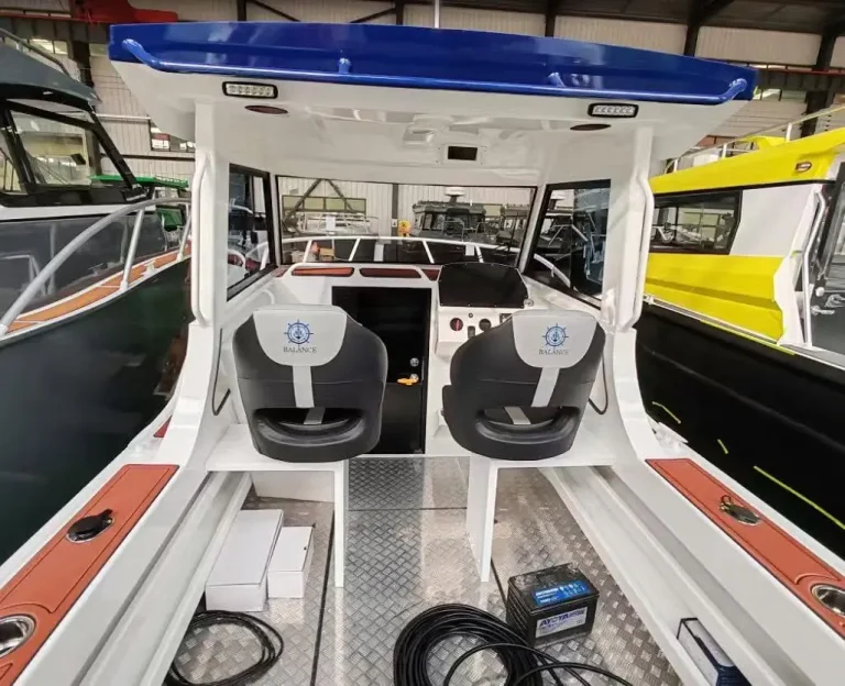 Twin helm seats and console with checker plate floor
