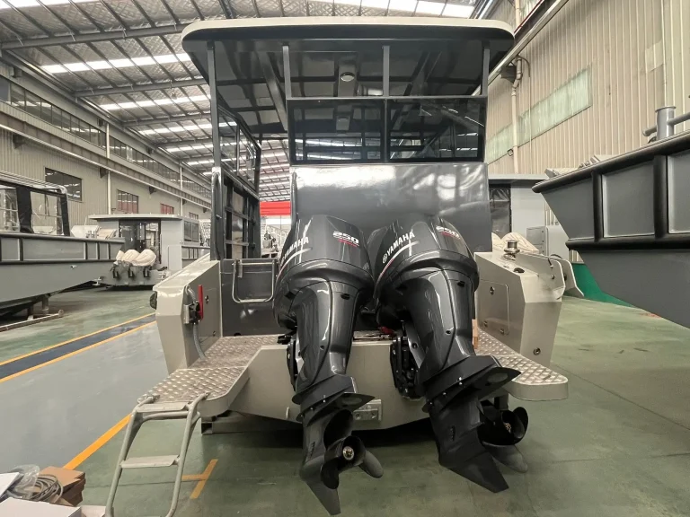 Twin outboards fitted during rigging