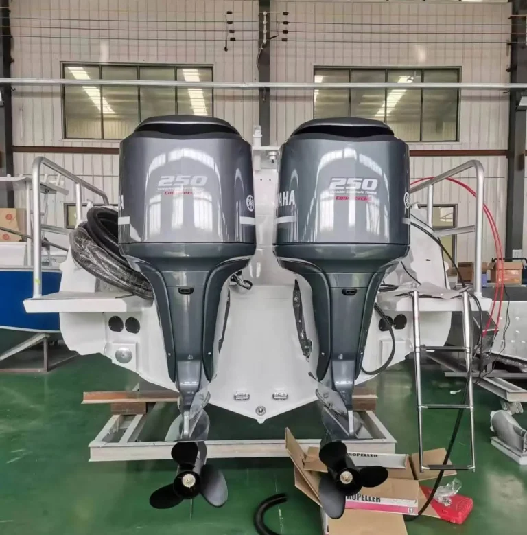 Twin outboards mounted on a transom in the factory