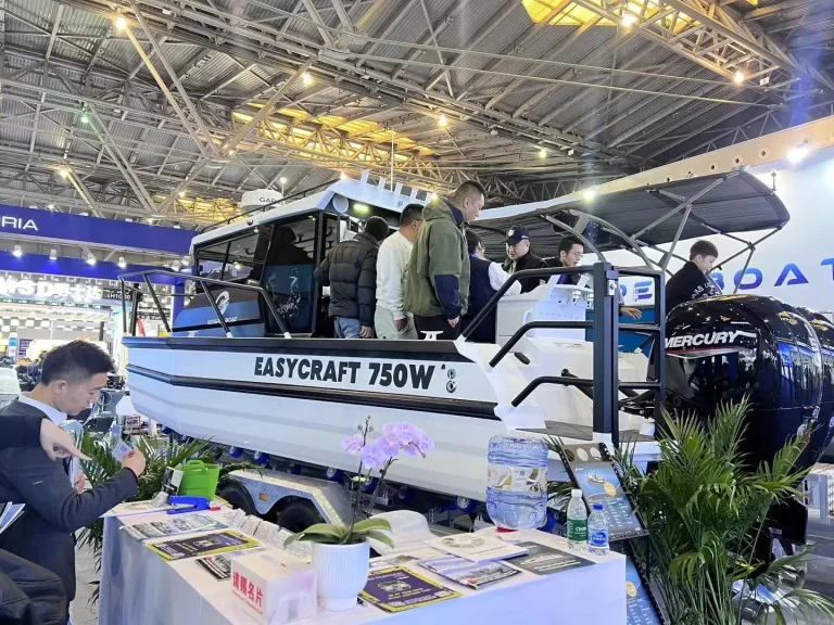 Visitors inspecting a plate aluminium boat at a boat show