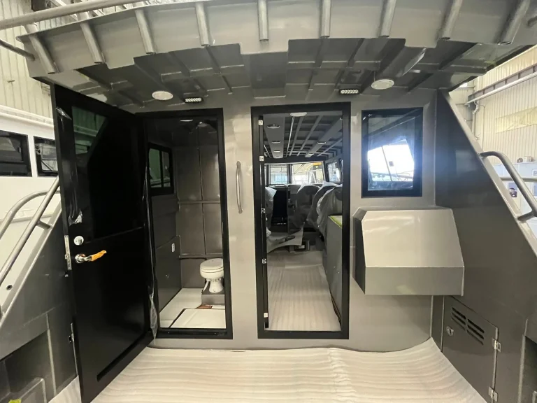 Wheelhouse doorway and toilet compartment on a work boat