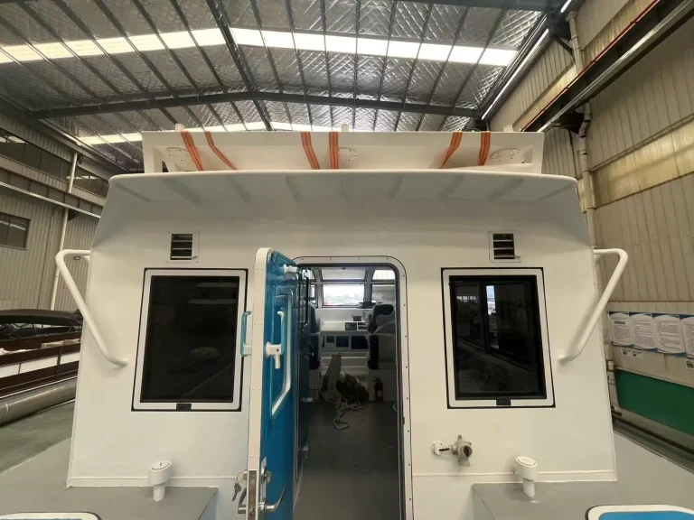 Wheelhouse front of a plate aluminium patrol boat