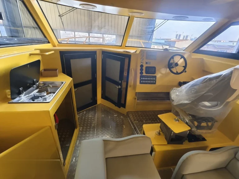 Wheelhouse interior of a yellow work boat