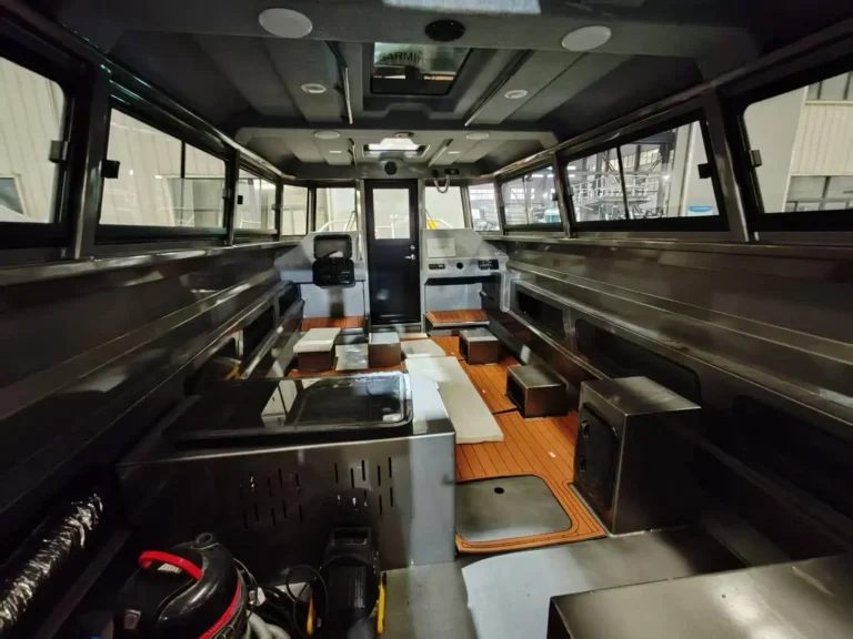 Wheelhouse interior with bench seating and wide windows