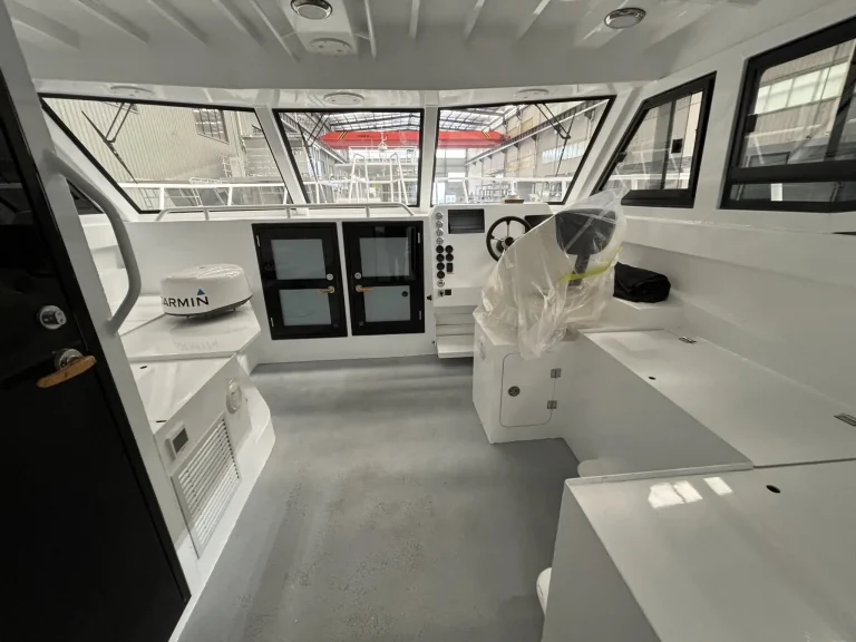Wheelhouse interior with wide windows and console
