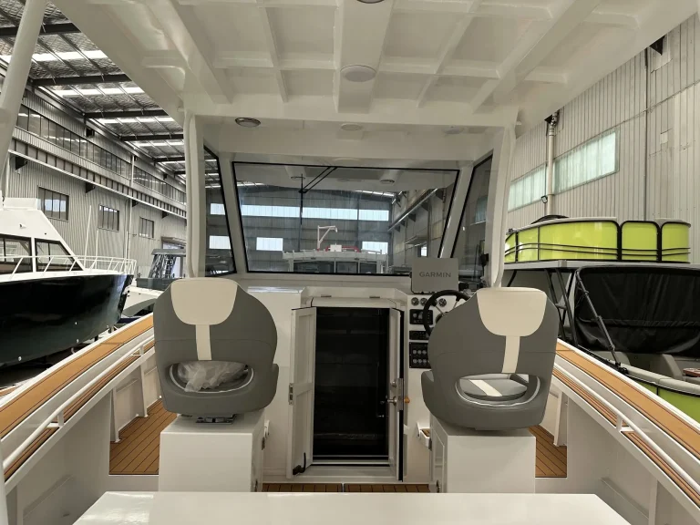 Wheelhouse with helm seats and timber look flooring