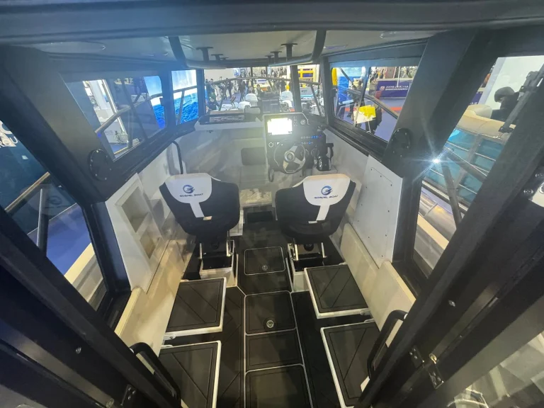 Wheelhouse with twin helm seats and wide windows