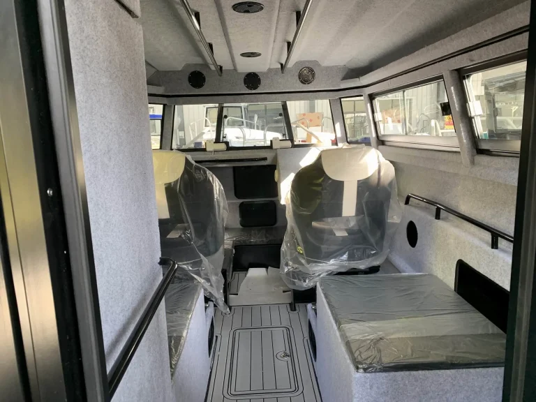 Wheelhouse with twin wrapped seats and wide windows