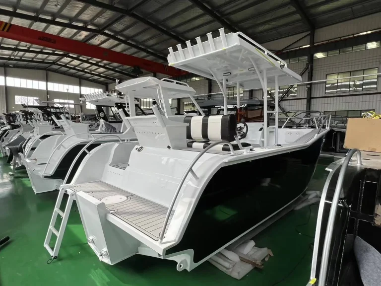 White centre console boats lined up in the factory