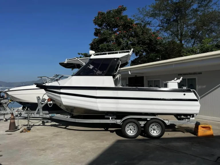 White plate aluminium hardtop cruiser on a trailer
