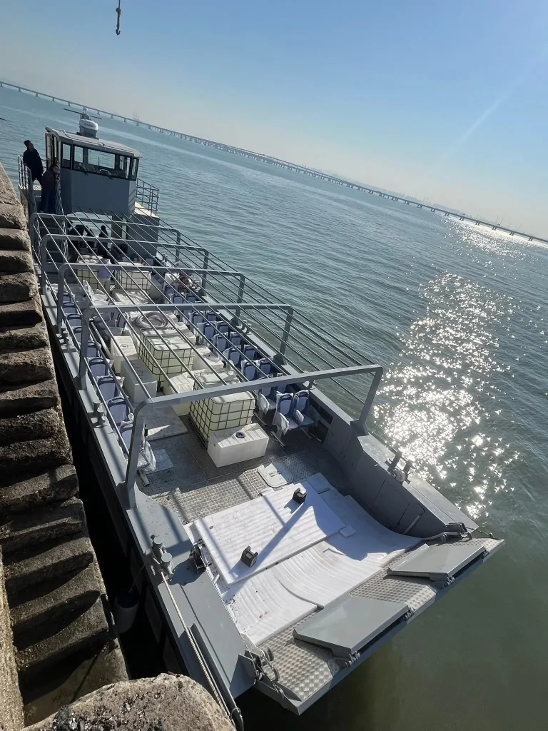 Work boat deck under way with a bridge behind