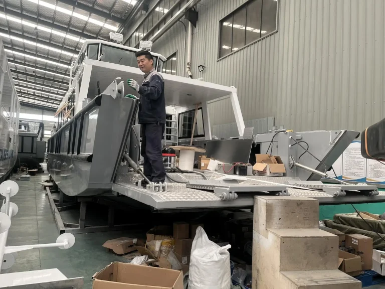 Worker finishing a plate aluminium superstructure
