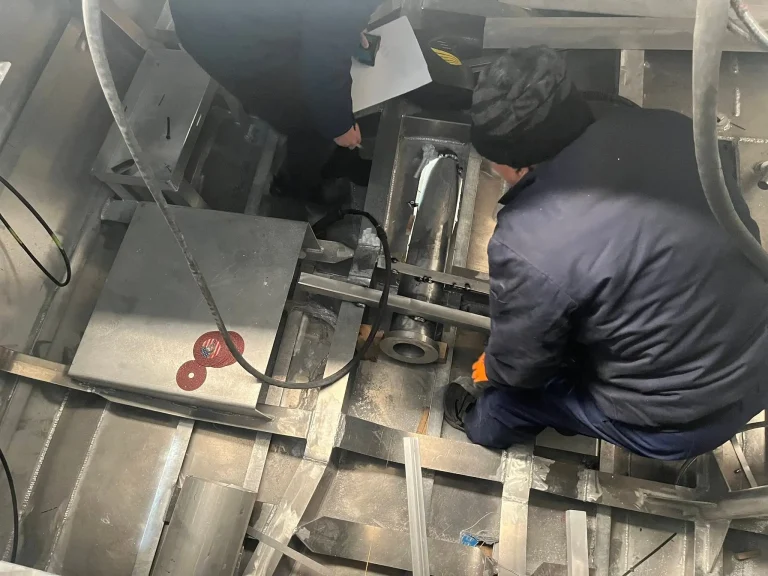 Worker fitting out an aluminium hull interior