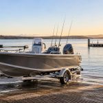 Aluminium fishing boat on a trailer at an Australian boat ramp